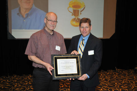 Steve Fleagle and Doug Eltoft hold IT Leadership award plaque