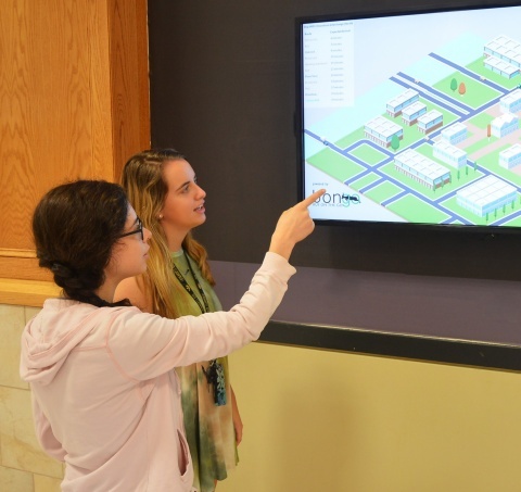 Students viewing digital signage