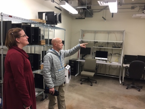 Chemistry department administrator Brenna Goode and Core IT Facilities manager Jerry Protheroe visit a reclaimed server room in the Chemistry Building. The department’s IT staff currently use the room as expansion and storage space.