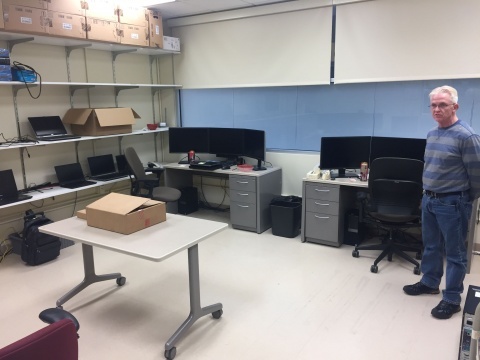 College of Public Health systems administrator Gary Hulett in the new work room for student IT staff at the University Capitol Center. The servers that once filled the room have been virtualized or relocated to secure data centers.