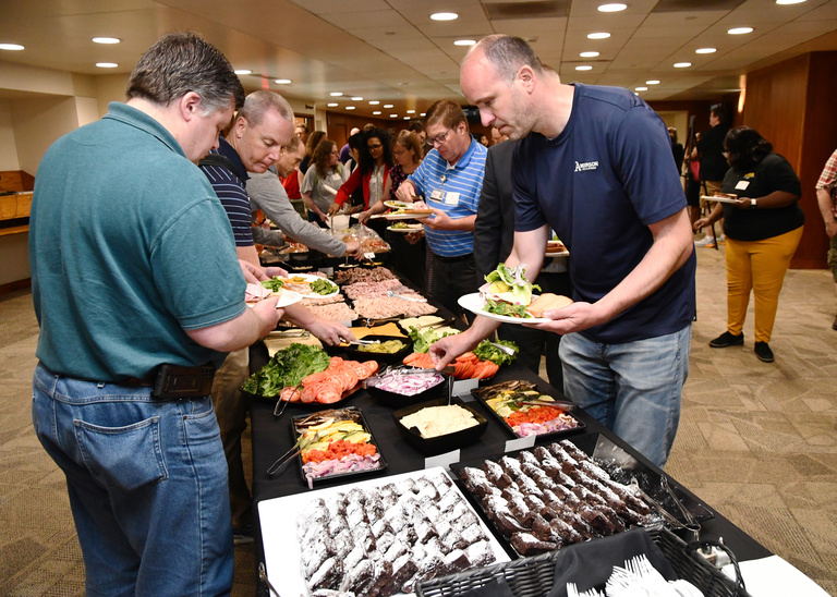 Tech Forum attendees go through lunch buffet line