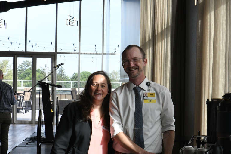 Andy Evans and colleague smile for photo