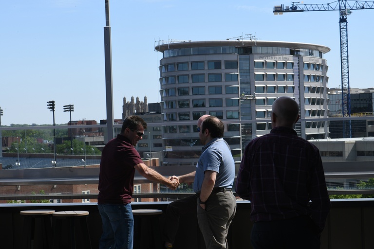 Tech Forum attendees enjoy the beautiful weather on the rooftop of the Courtyard by Marriott by Kinnick Stadium
