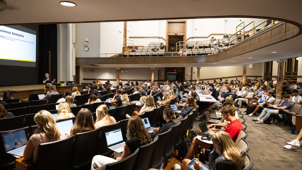 Students in a lecture hall for Foundations of Business